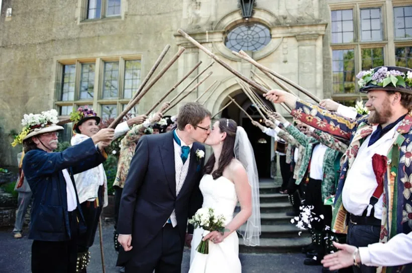 The Leominster Morris dancers doing a guard of honour at a wedding.