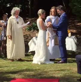 An outside blessing being performed in the gardens by famous celebrants Peter Owen Jones and Philip Carr-Gomm
