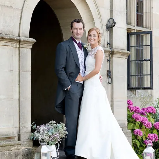 A wedding couple on the front steps.