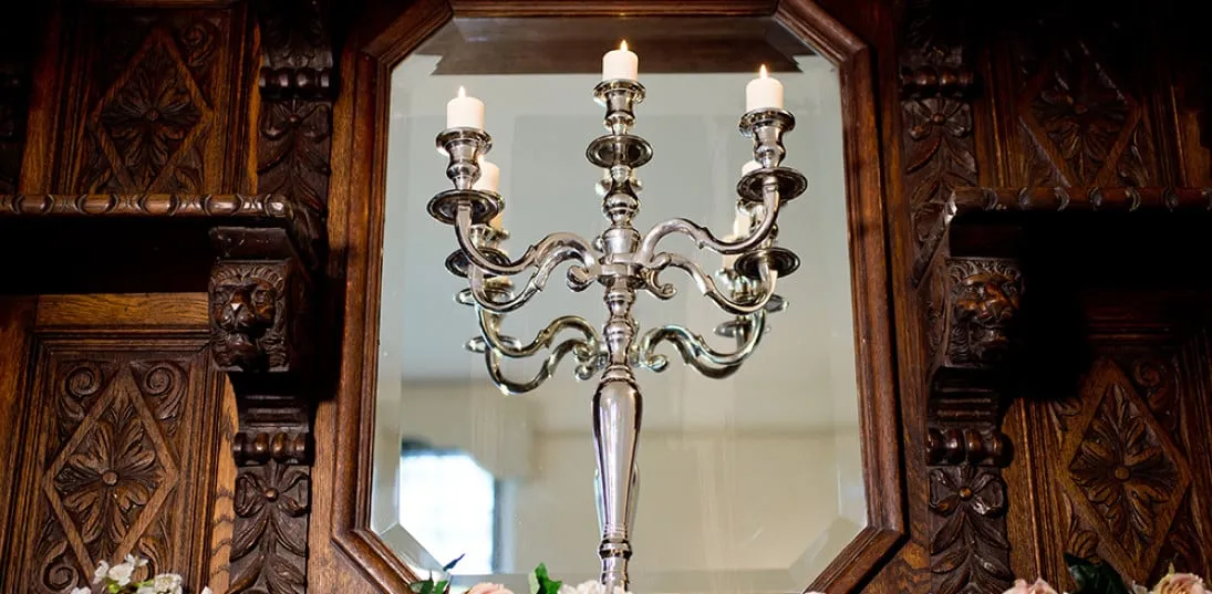 Decorating a fireplace at a wedding with your colour scheme.