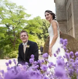 A wedding couple by the cider press.